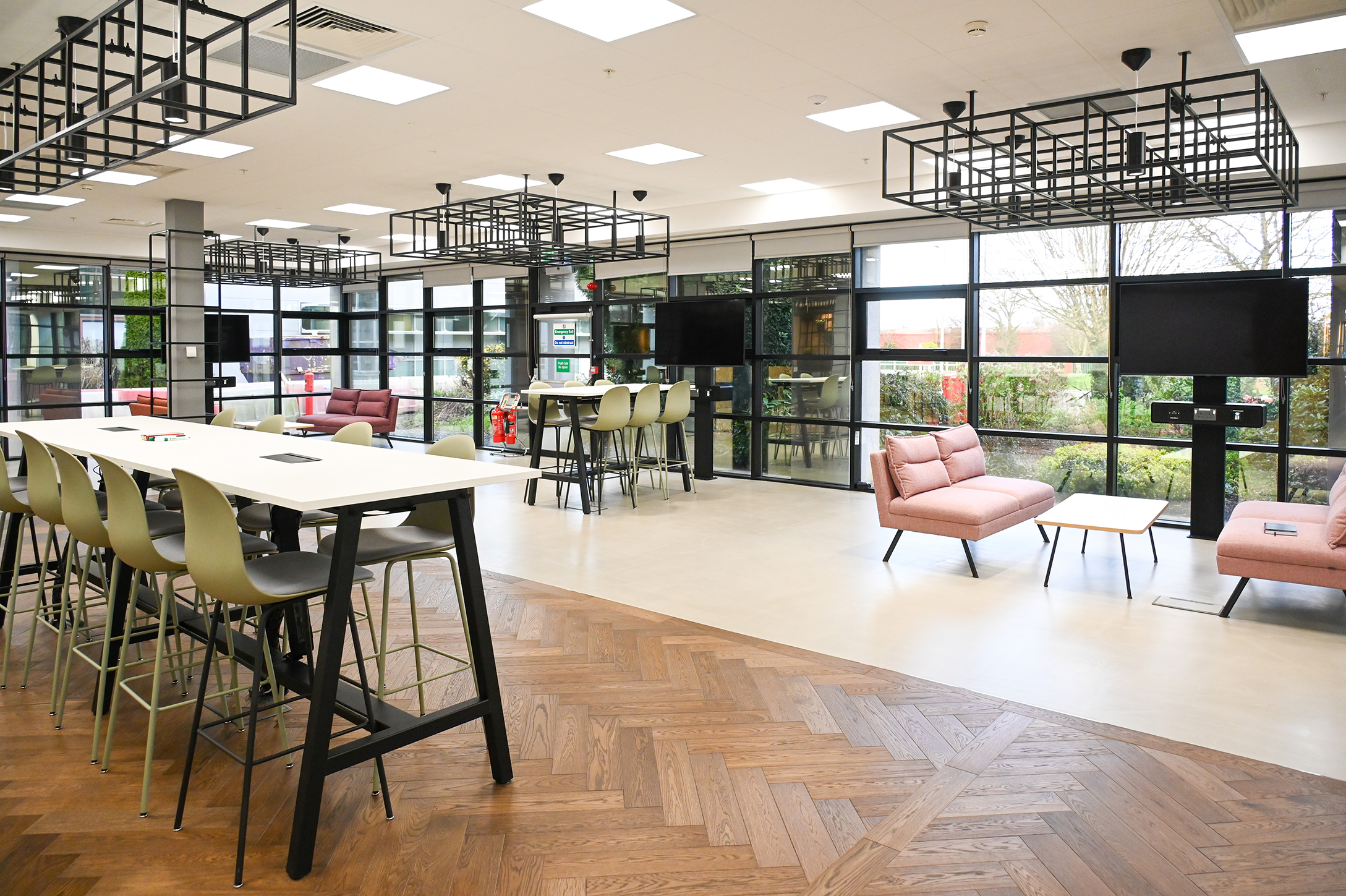 an open plan office with various zones for different types of work and collaboration
